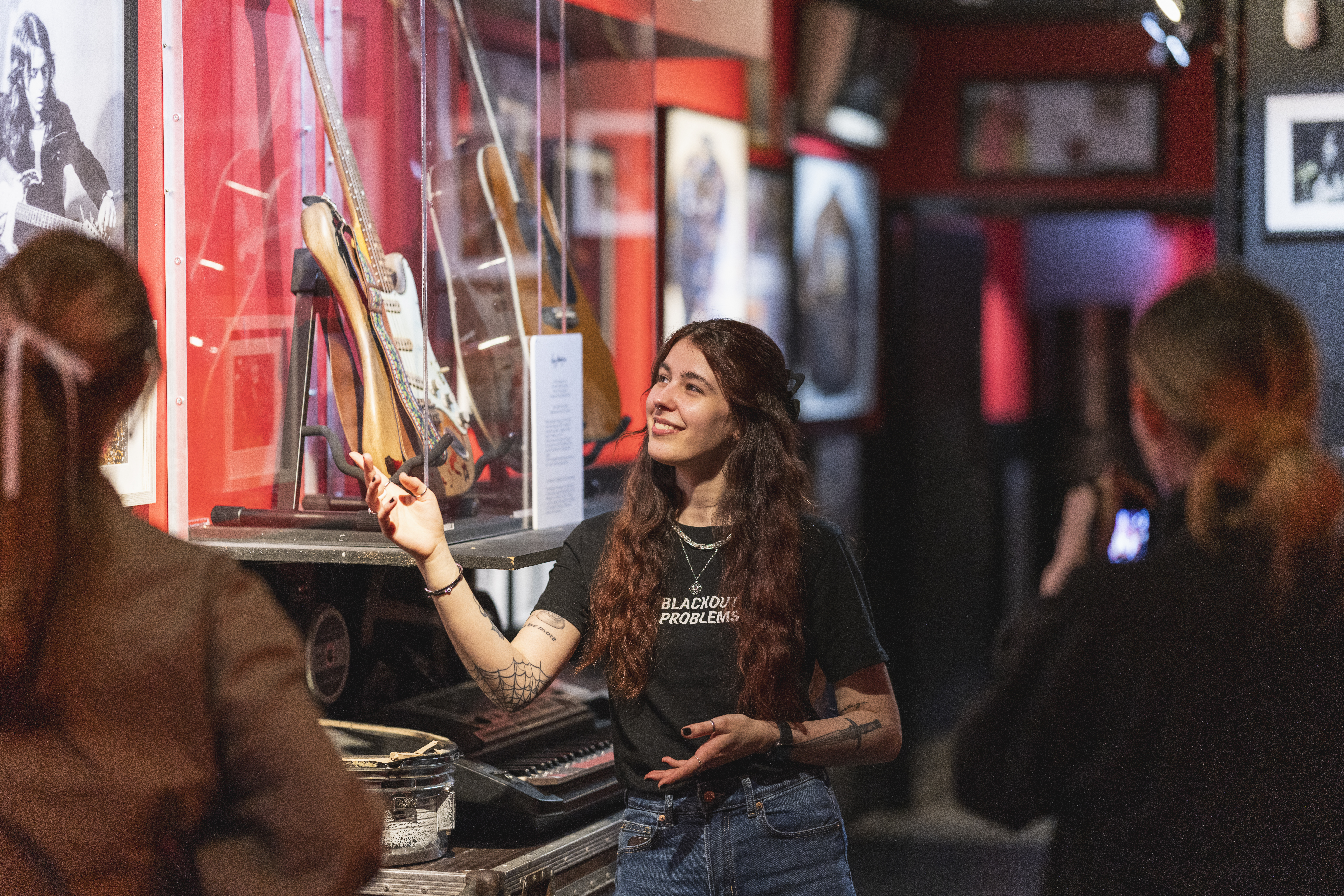 tour guide showcasing memorabilia