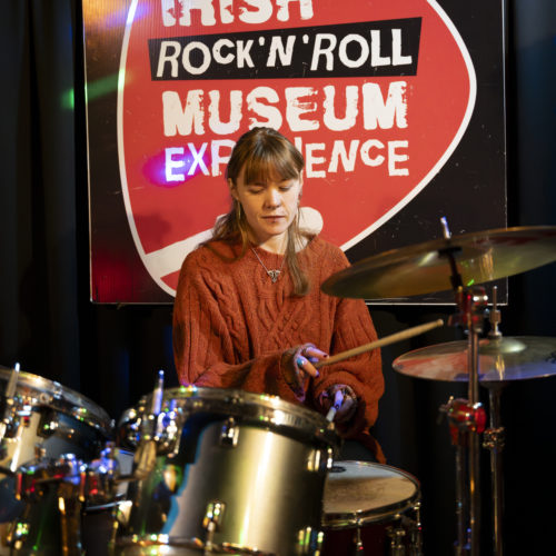 up close of girl playing drums