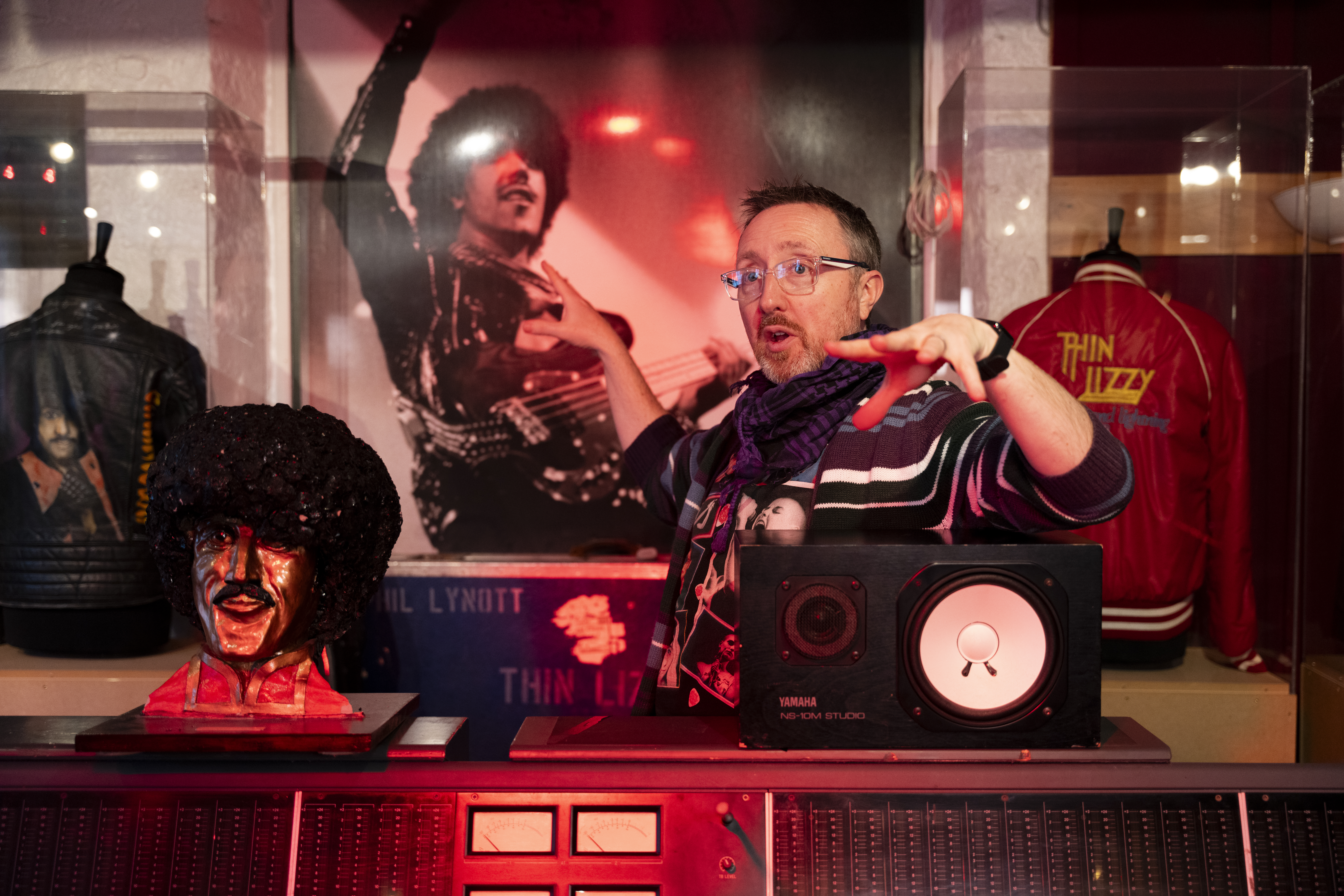 tour guide showing and talking about Thin Lizzy memorabilia
