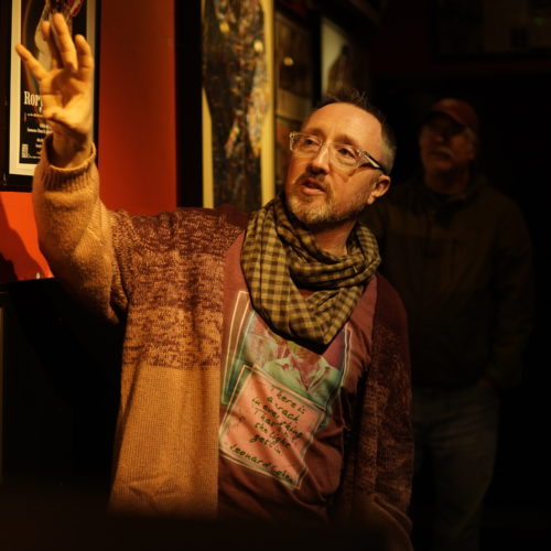 tour guide showing interior of Rock 'n' Roll museum