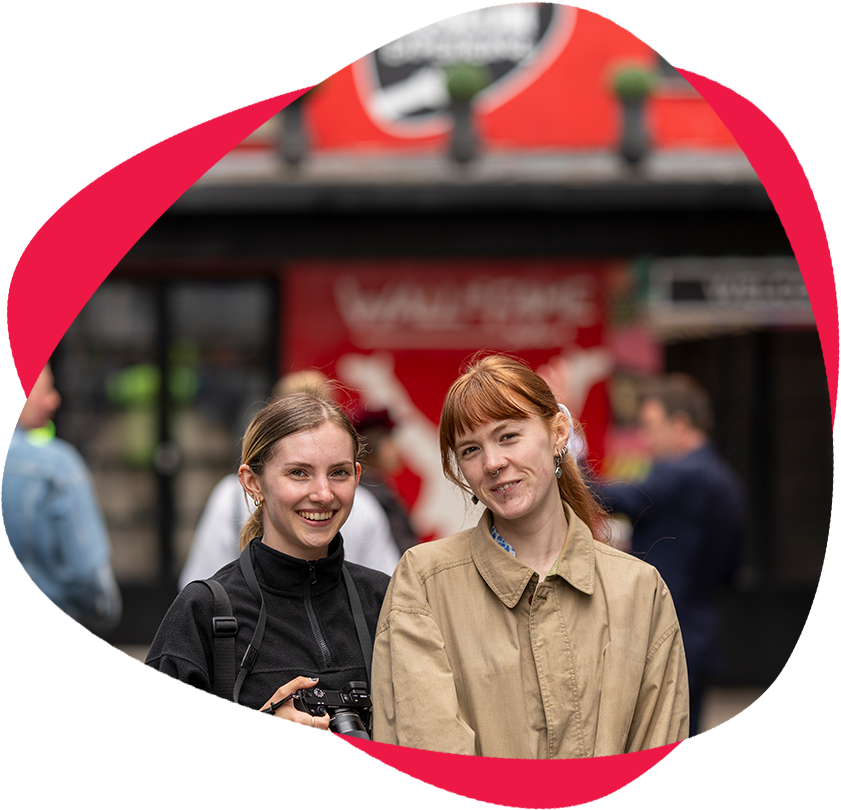two women smiling standing outside Irish Rock 'n' Roll Museum