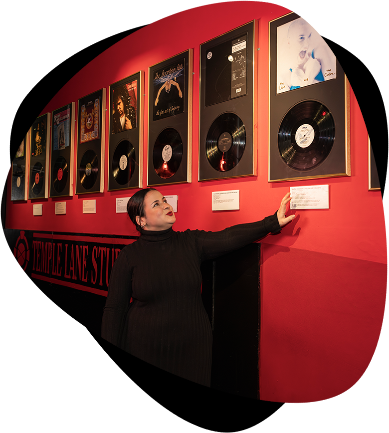 tour guide showing walls of vinyl
