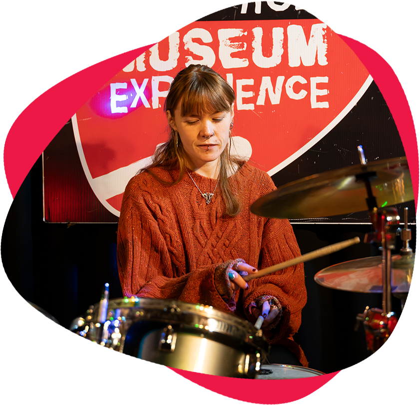 up close of girl playing drums