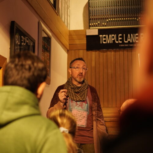 tour guide showing tourists around